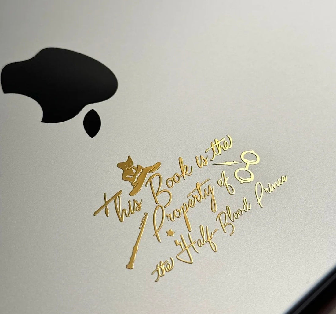 custom laptop stickers on a silver MacBook